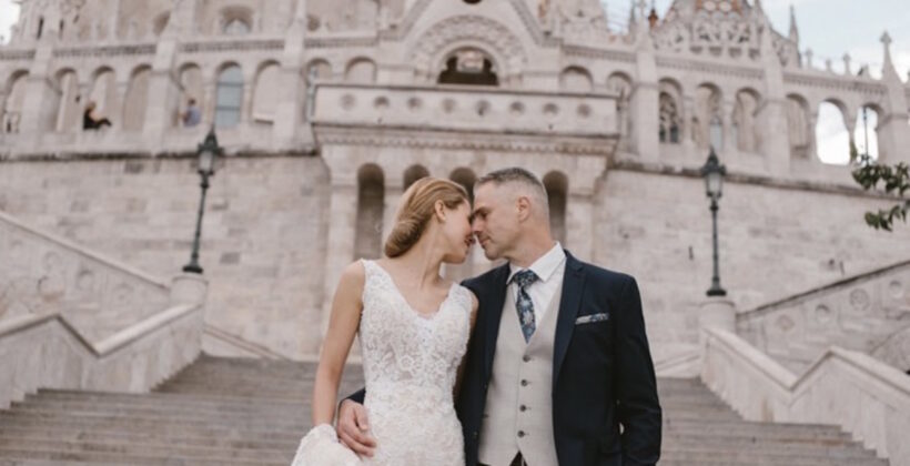 fairytale wedding portraits at Fisherman's Bastion Budapest, with Mathias Church in the background
